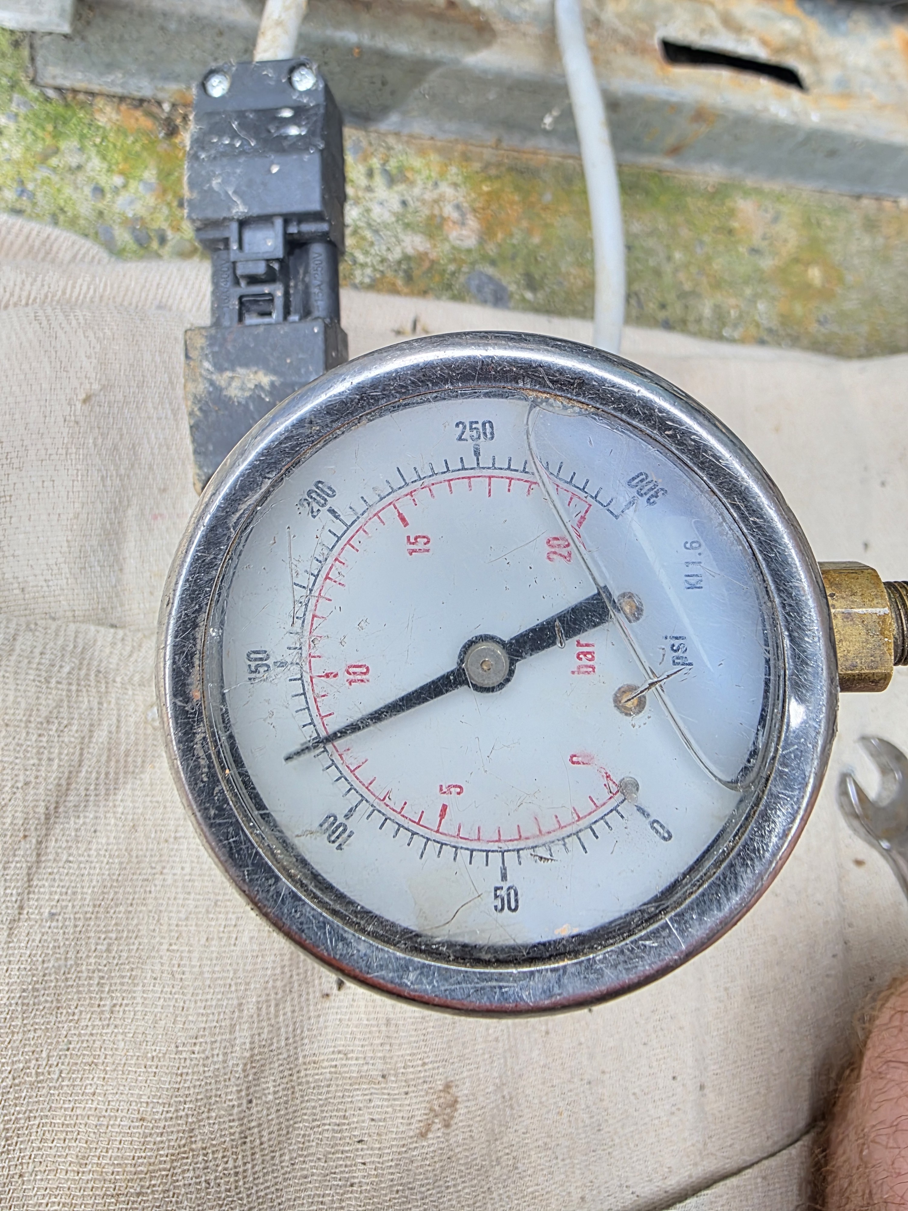 Pressure test gauge connected to pipework during a heating system pressure test